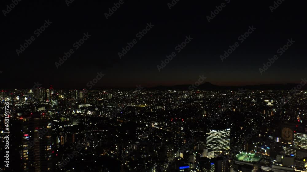 TOKYO, JAPAN : Aerial view of sunrise CITYSCAPE and MOUNT FUJI. Rising sun, beautiful colorful dawn sky and buildings. Japanese city life and nature concept. Long time lapse video, night to morning. TOKYO, JAPAN : Aerial view of sunrise CITYSCAPE and MOUNT FUJI. Rising sun, beautiful colorful dawn sky and buildings. Japanese city life and nature concept. Long time lapse video, night to morning.