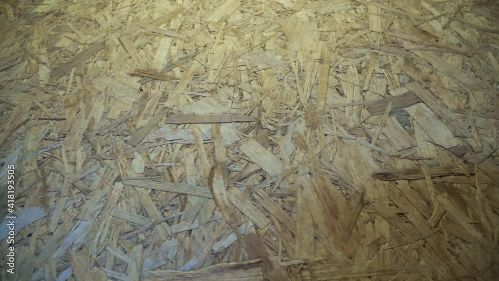OSB board stored in a warehouse. Sheet building material for the construction of partitions. Wooden OSB board for building a house. OSB board stored in a warehouse. Sheet building material for the construction of partitions. Wooden OSB board for building a house.
