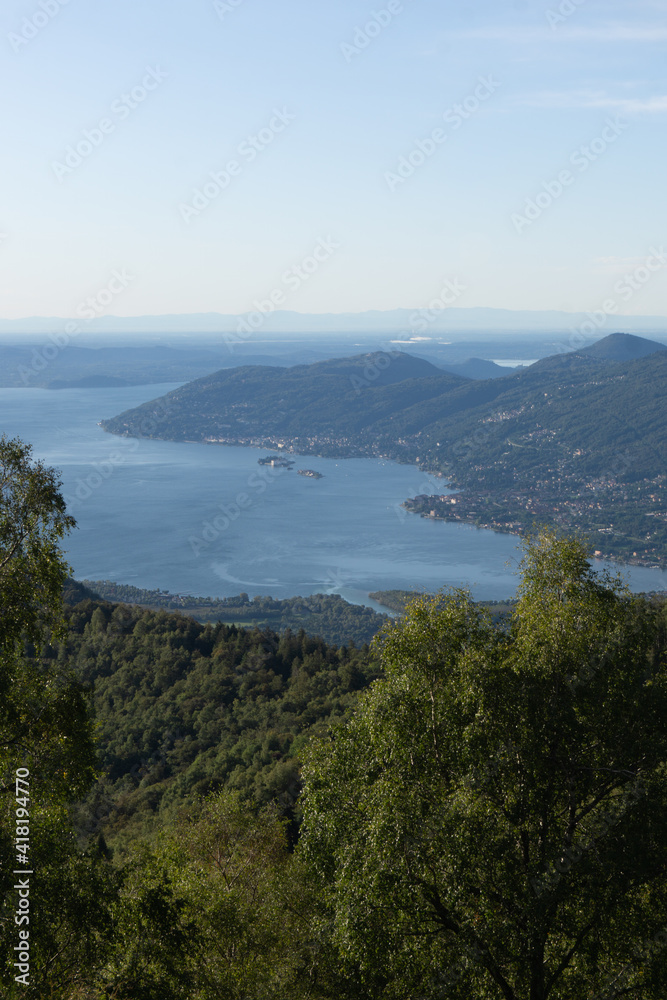 Lake maggiore and lake mergozzo seen from the mountains of val d'ossola during a summer day, near the town of Mergozzo, italy - September 2020.
