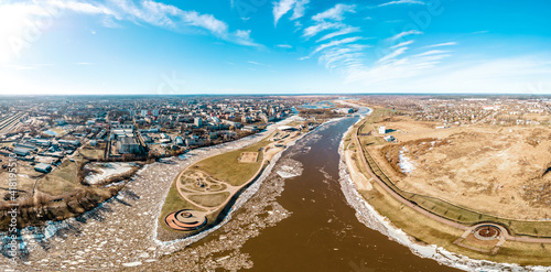 Aerial Panoramic view of Jelgava city (postal island) in early spring or winter with large ice cubes in the river photo