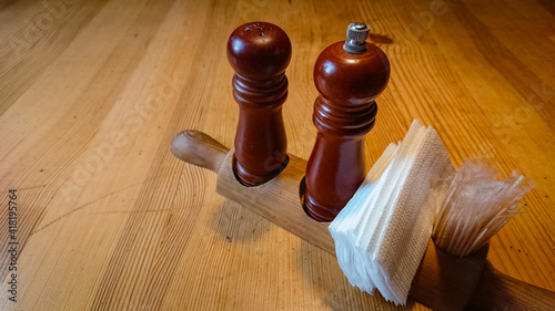Wooden salt and pepper shakers on the table