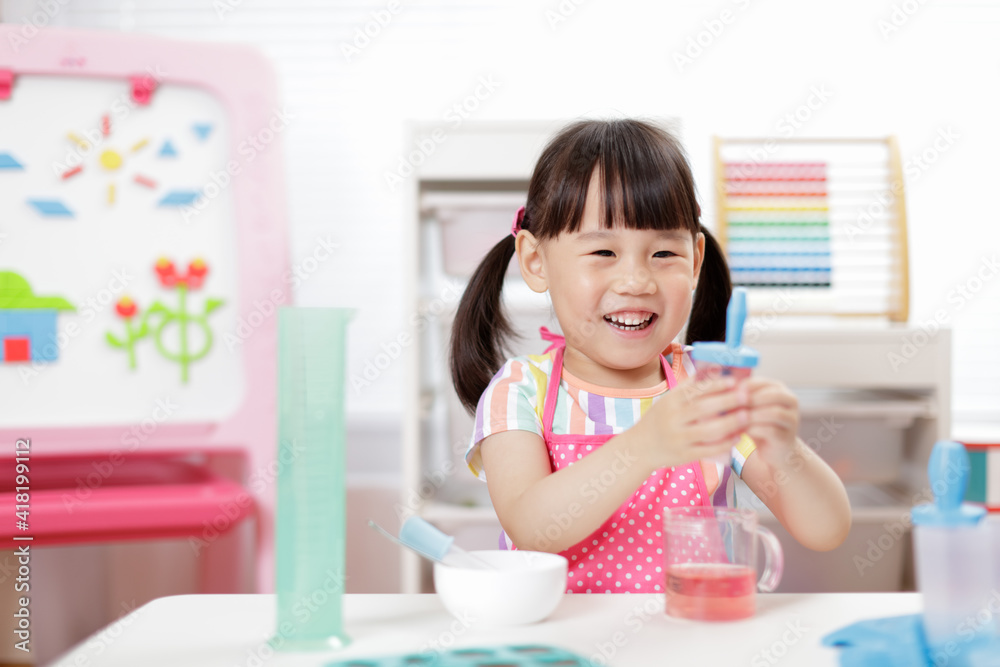 young girl making ice lolly for homeschooling young girl making ice lolly for homeschooling