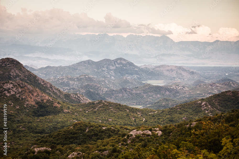 Obraz premium Incredible Montenegro sunset overlooking mountains and lake