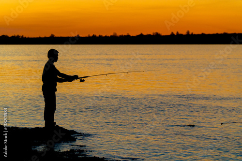 man fishing at the sunset brazil