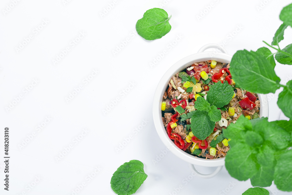 Mexican dish with tuna, corn and hot peppers with fresh mint Mexican dish with tuna, corn and hot peppers with fresh mint