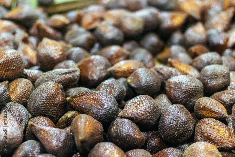 close up view of a pile of black and white peppercorns close up view of a pile of black and white peppercorns