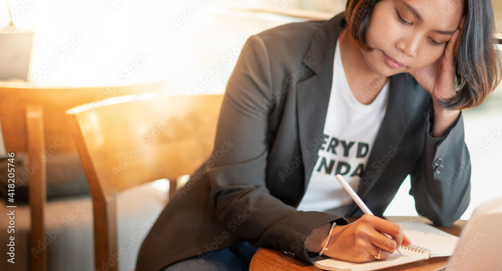Business woman stressed from find the new job because unemployed while sitting at the coffee shop, Business woman stressed from find the new job because unemployed while sitting at the coffee shop,