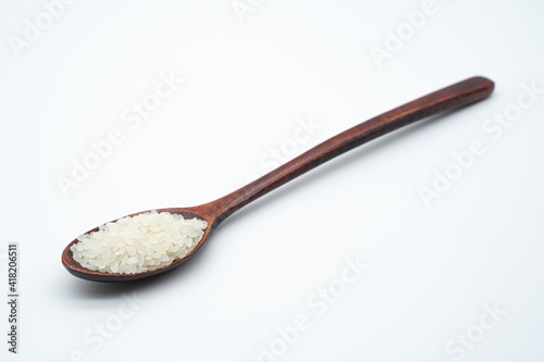 Concept image of grain using spoon and rice