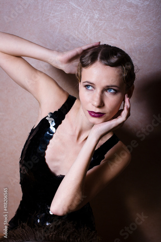 beauty blond woman in studio on black background, stylish fashion retro vintage copyspace close up