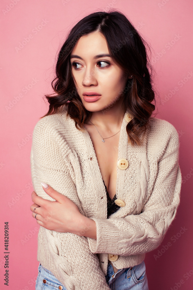 young pretty girl with curly hair posing cheerful on pink background, lifestyle people concept young pretty girl with curly hair posing cheerful on pink background, lifestyle people concept