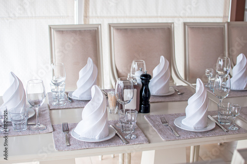 White banquet Table served for a party or a wedding celebration clean plates and napkins