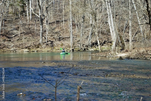 Canvas-taulu Man kayaking on the Little Miami river in the spring near yellow springs ohio