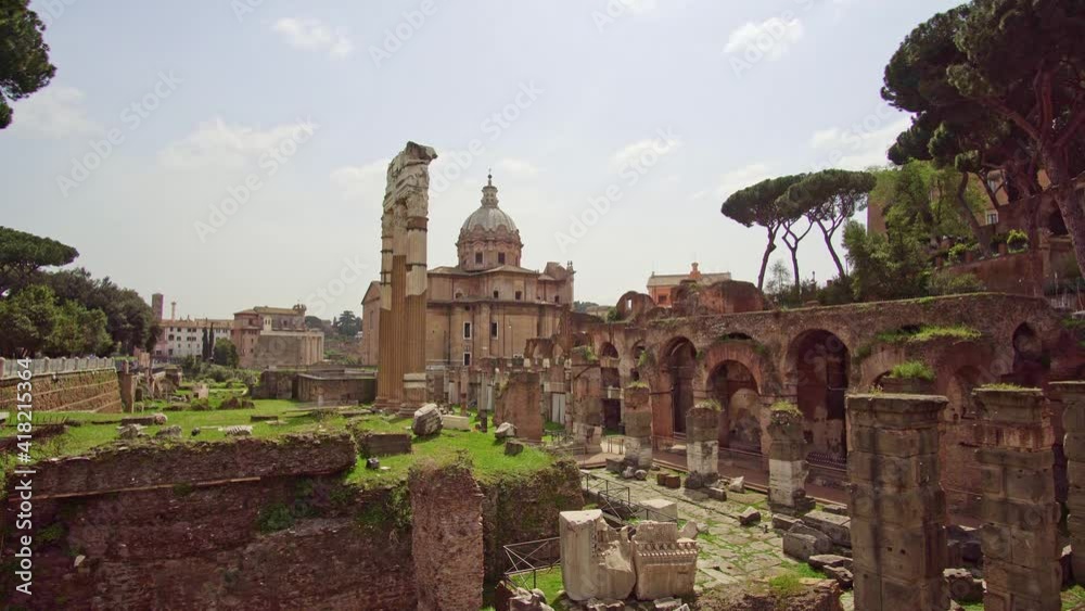 Rome, Italy - April 4, 2021: Roman Forum. Temple of Castor and Pollux and church of Santi Luca e Martina on ruins of the Forum Romanum in Rome. Travel and vacation in Italy