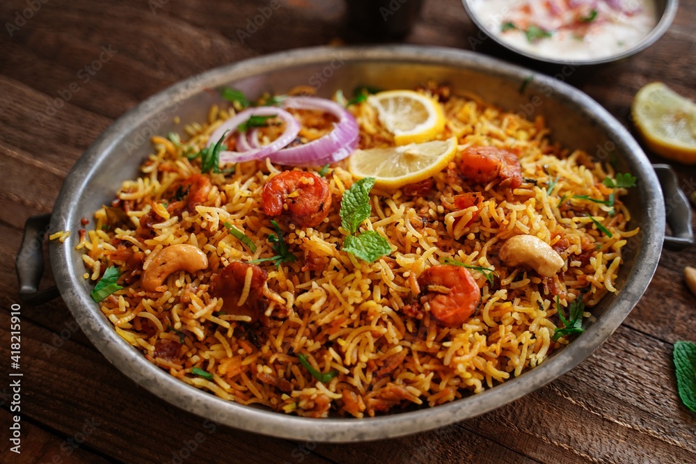 Homemade Prawn Shrimp biryani served with Yogurt Raita and beet pickle Homemade Prawn Shrimp biryani served with Yogurt Raita and beet pickle