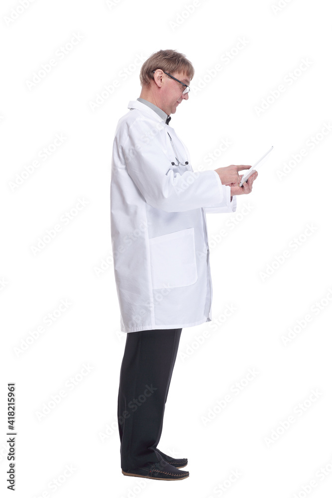attending doctor using a digital tablet.isolated on a white background. attending doctor using a digital tablet.isolated on a white background.