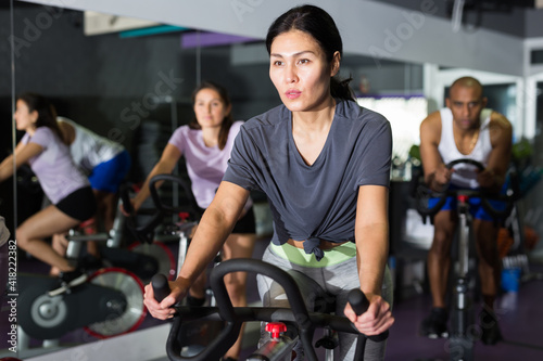 Woman and other females working out in sport club