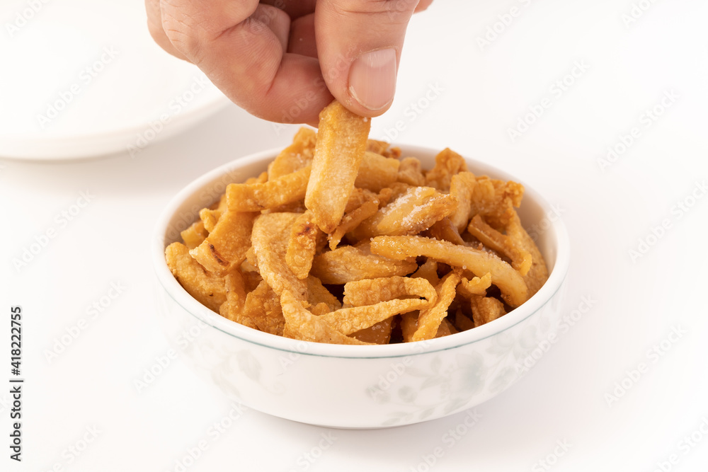 Fresh fried pork dregs on a pure white background Fresh fried pork dregs on a pure white background