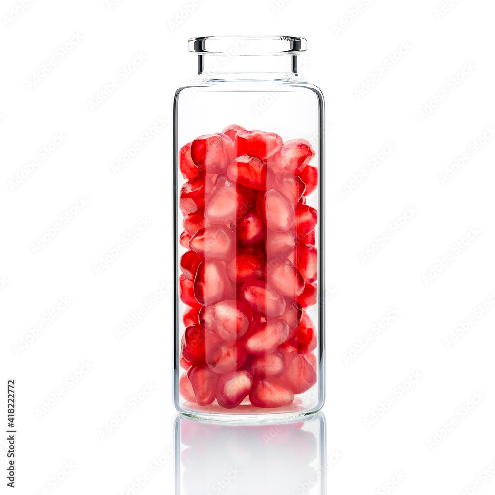  Homemade skin care with pomegranate seeds in a glass bottle  isolate on white background.