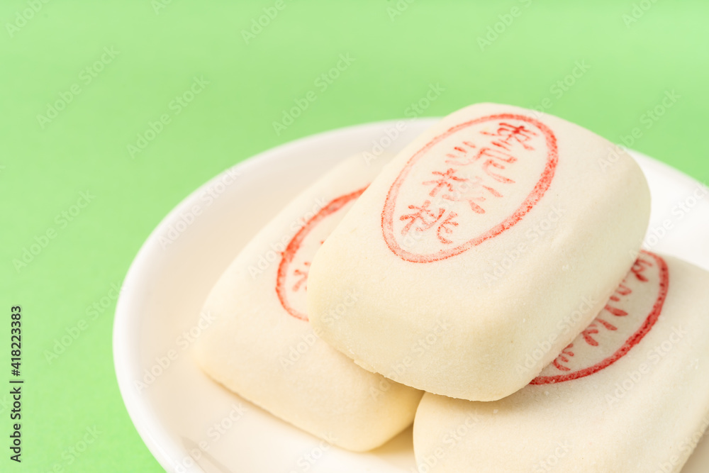 Jujube paste walnut cake with solid color background Jujube paste walnut cake with solid color background