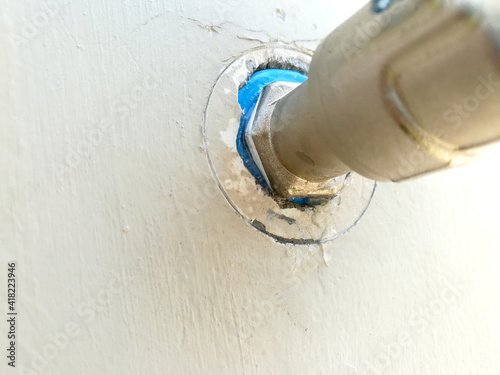 Defective faucet. Cause wastage of water or leaky faucet, Leaking water tap has drips along the joints.