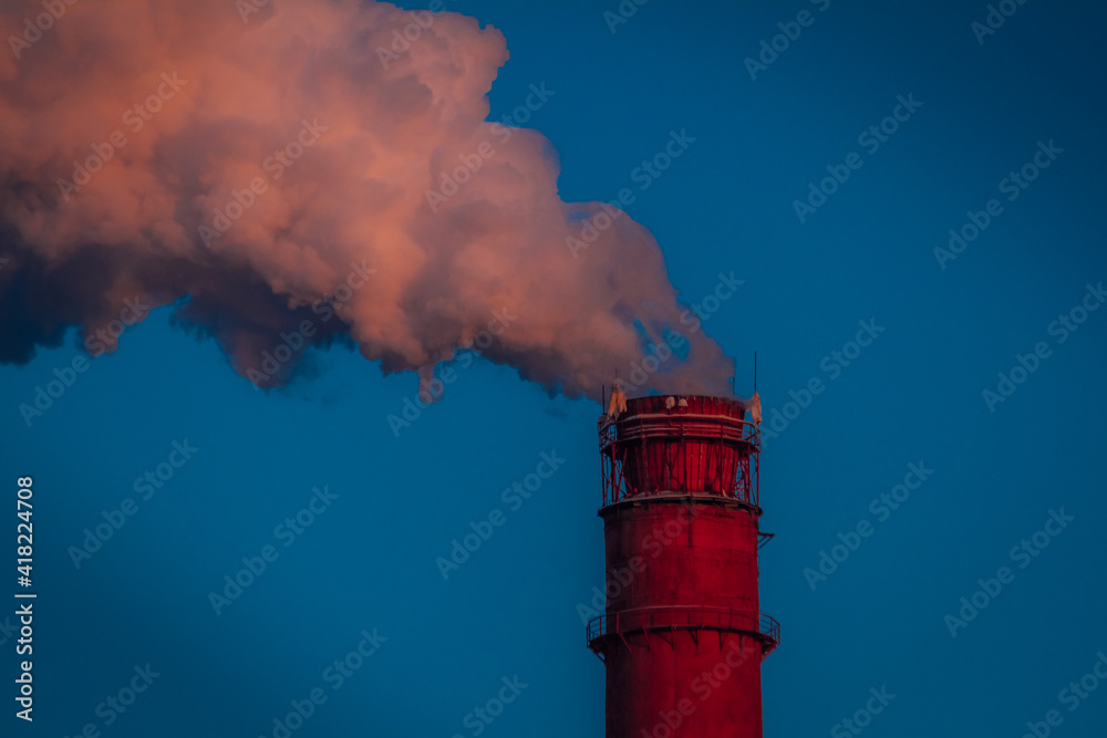 thick smoke from fuel combustion is pouring into the atmosphere from a huge chimney of a thermal power plant thick smoke from fuel combustion is pouring into the atmosphere from a huge chimney of a thermal power plant