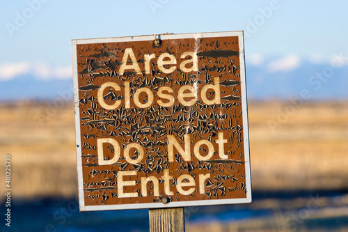 USA, Colorado. An aged warning sign in the Monte Vista National Wildlife Refuge. photo