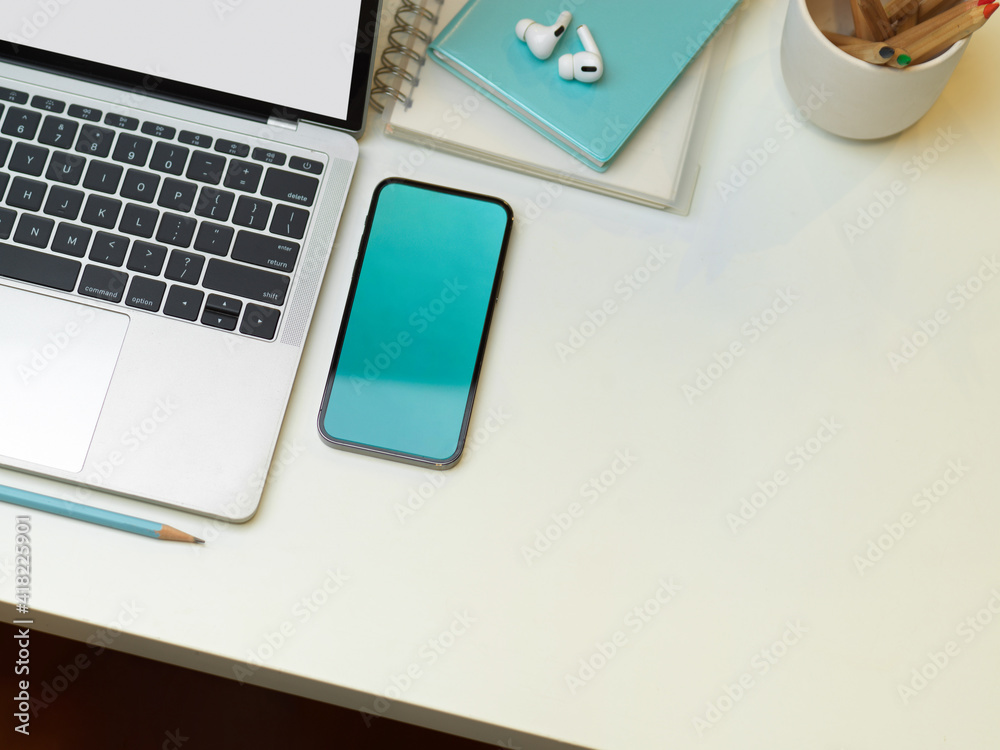 Creative flat lay photo of workspace with laptop, smartphone, stationery and copy space Creative flat lay photo of workspace with laptop, smartphone, stationery and copy space