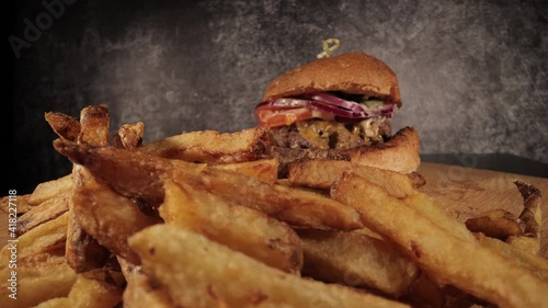 Delicious Cheeseburger with French fries - food photography photo