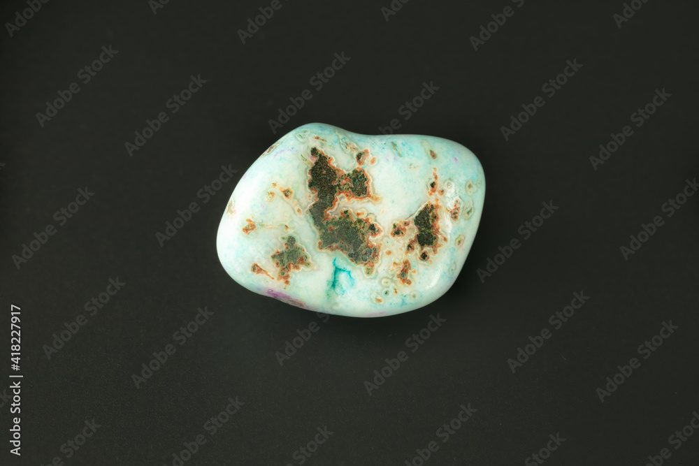 pegmatite nature textured blue stone on black surface pegmatite nature textured blue stone on black surface