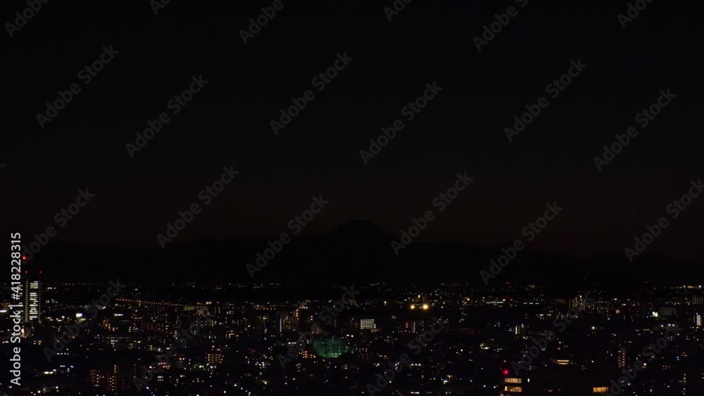 TOKYO, JAPAN : Aerial sunrise CITYSCAPE of TOKYO and MOUNT FUJI. View of rising sun, dawn sky and buildings. Japanese city life and nature concept. Time lapse zoom in video, night to early morning. TOKYO, JAPAN : Aerial sunrise CITYSCAPE of TOKYO and MOUNT FUJI. View of rising sun, dawn sky and buildings. Japanese city life and nature concept. Time lapse zoom in video, night to early morning.