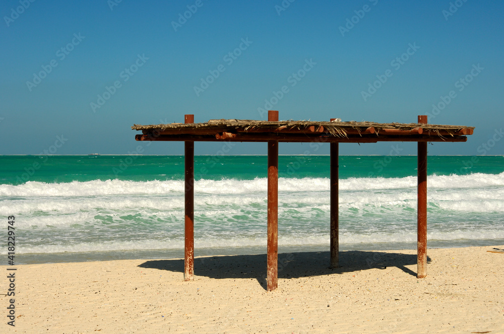 Simple Sun Protection On The Jumeirah Beach, Persian Gulf, Dubai, United Arab Emirates Simple Sun Protection On The Jumeirah Beach, Persian Gulf, Dubai, United Arab Emirates