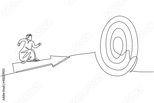 Single continuous line drawing of young Arabian businessman ride arrow symbol and flying to hit target. Smart professional manager. Minimalism concept one line draw graphic design vector illustration