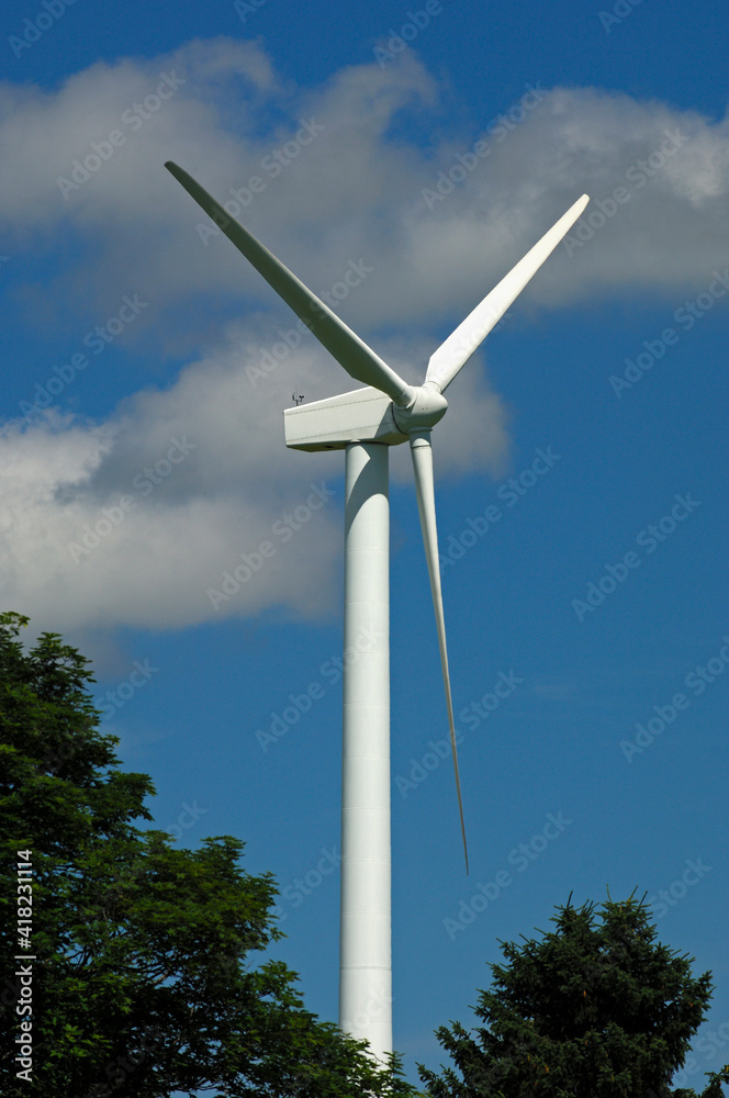 Tall Wind Turbine Against Blue Sky, Switzerland Tall Wind Turbine Against Blue Sky, Switzerland