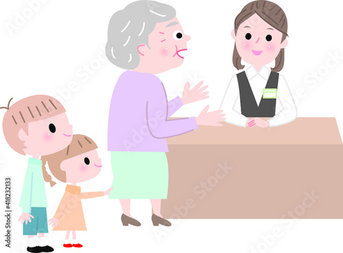 受付に行く孫連れシニア女性