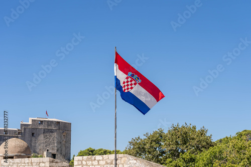 National flag of Croatia on top of old town city wall in Croatia summer morning