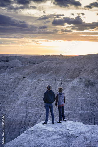 two guys taking in sunset view