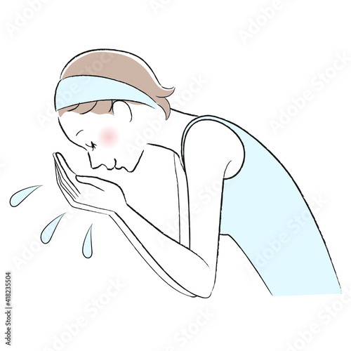 A woman washes her face