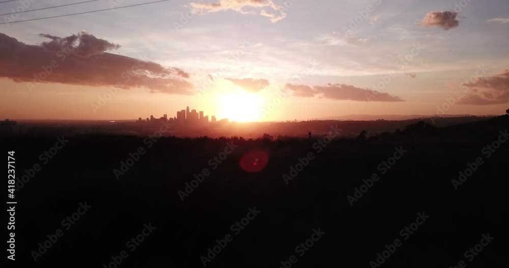 Drone fly by of a hill during a beautiful sunset Drone fly by of a hill during a beautiful sunset