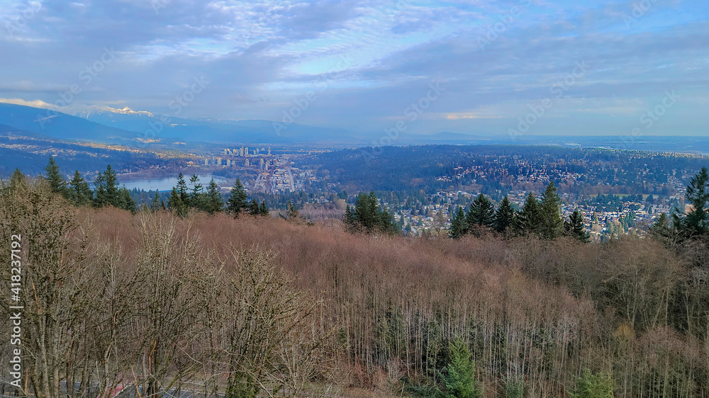 Clouds fanning out over Fraser Valley and Burrard Inlet, BC, as seen from Burnaby Mountain - winter