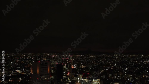 Wallpaper Mural TOKYO, JAPAN : Aerial sunrise CITYSCAPE of TOKYO and MOUNT FUJI. View of rising sun and buildings around Shibuya. Japanese city life and nature concept. Time lapse tracking video, night to morning. Torontodigital.ca