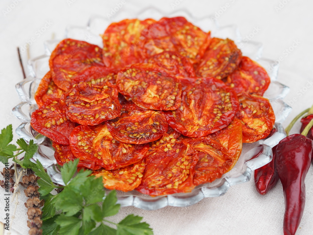 The concept of healthy eating,the benefits of dried fruits and vegetables. Dried tomato vegetable chips with ingredients for making sandwiches on a wooden table. The concept of healthy eating,the benefits of dried fruits and vegetables. Dried tomato vegetable chips with ingredients for making sandwiches on a wooden table.