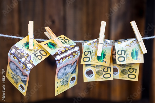 pinned banknotes on a clothes line. concept of money laundering photo