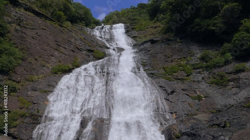 Beautiful waterfall in Tao, near Hienghene, New Caledonia. Slow motion tilt. photo