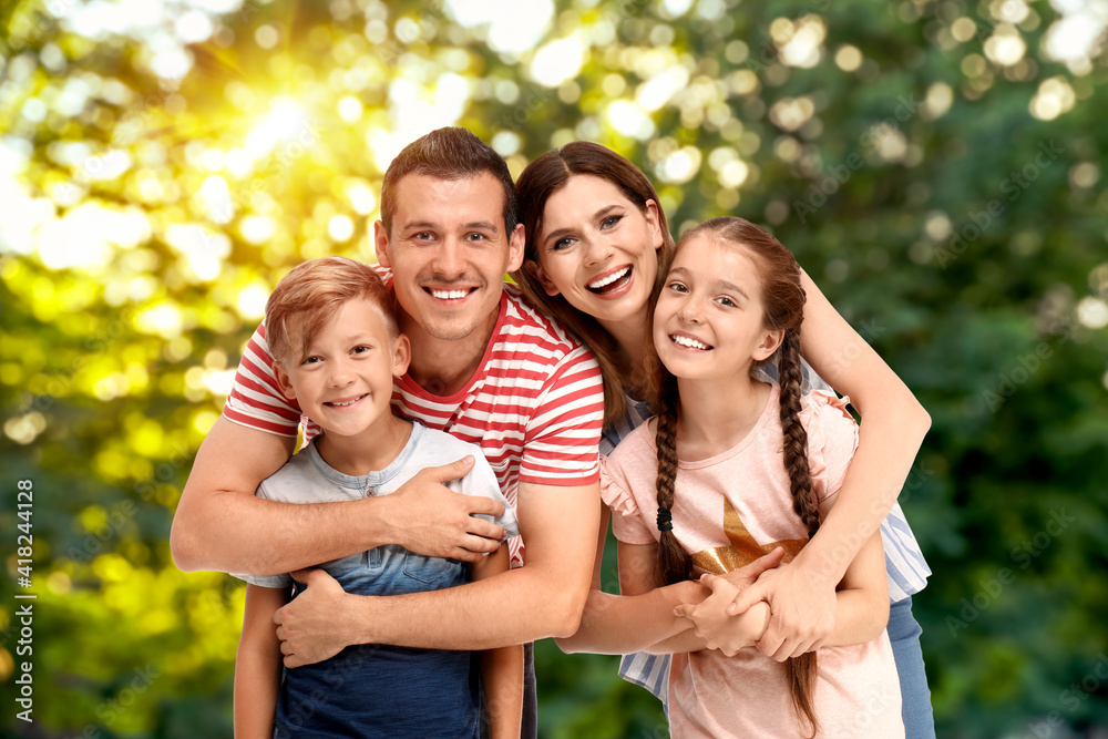 Happy family with children outdoors on sunny day