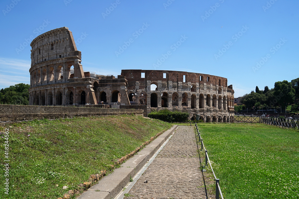 Ancient Roman amphitheater and gladiator arena Colosseum, heart of Roman Empire, famous tourist landmark, guided tour concept, Rome, Italy
