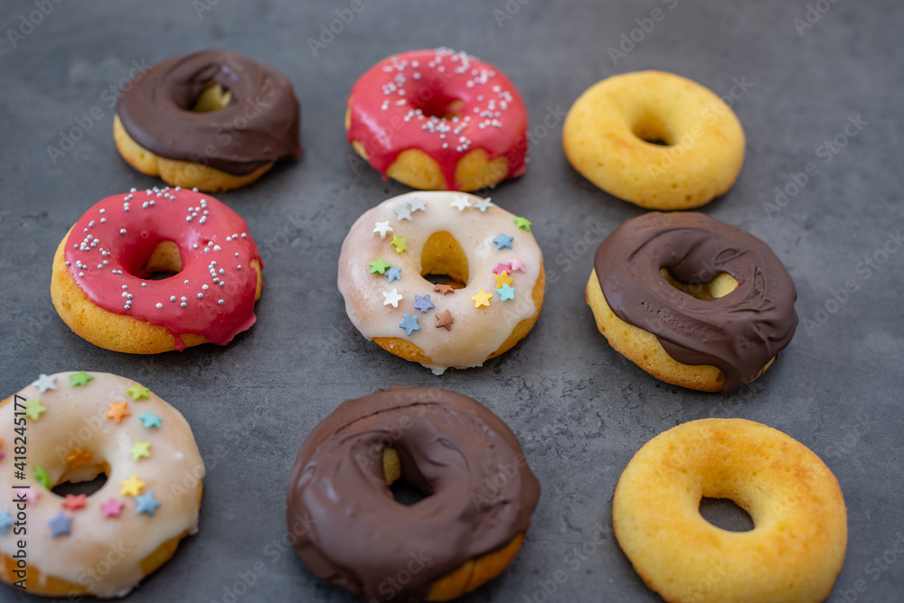 Donuts pattern. Top view of assorted glazed donuts. Donuts pattern. Top view of assorted glazed donuts.