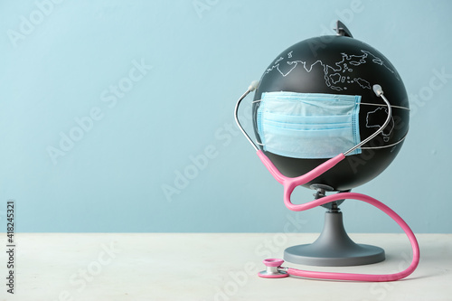 Globe with medical mask on ...