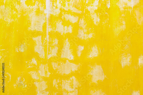 Abstract yellow cement wall texture and background splashed with white paint