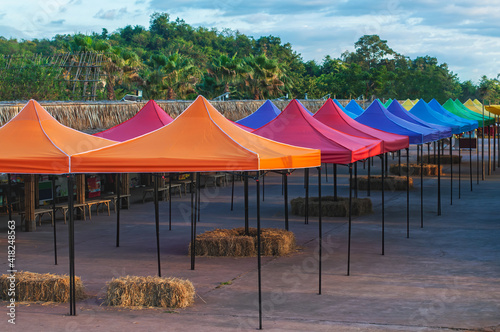 Colorful outdoor canopy tent for event and festival in park photo