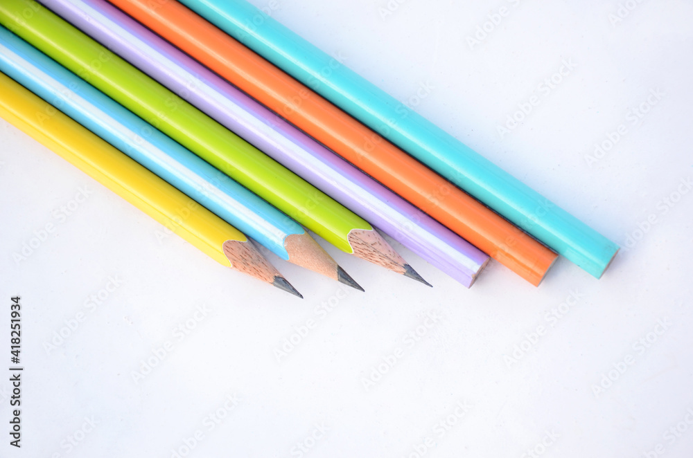 bunch the colorful wooden peels pencils isolated on white background. bunch the colorful wooden peels pencils isolated on white background.